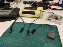 1531 with its original Mini-DIN-7 connector; 1535 and sd2iec with their new Mini-DIN-7 connectors; adaptor from Mini-DIN-7 to cassette port edge connector.